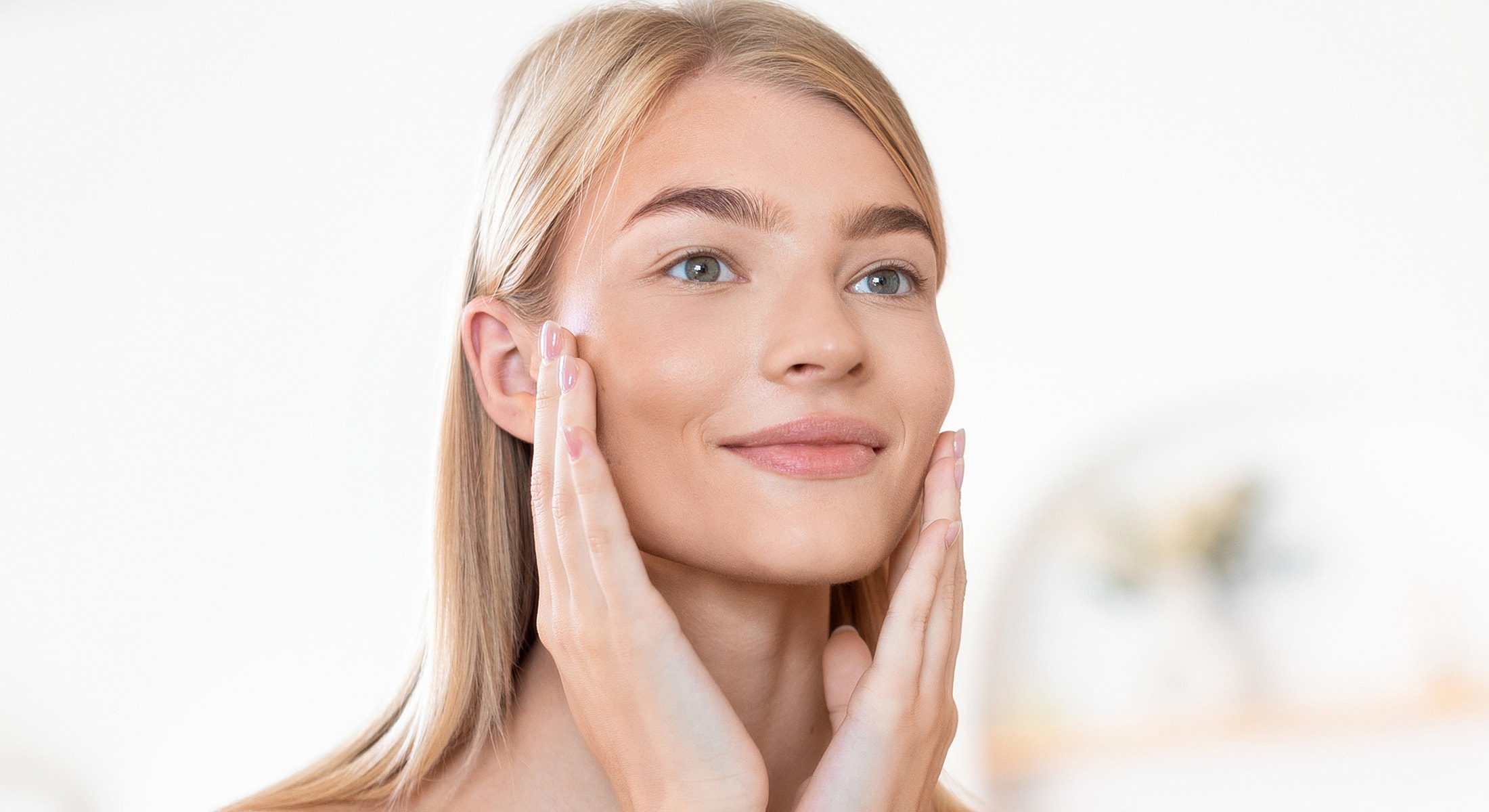 Portrait of a woman with soft lighting and shadows.