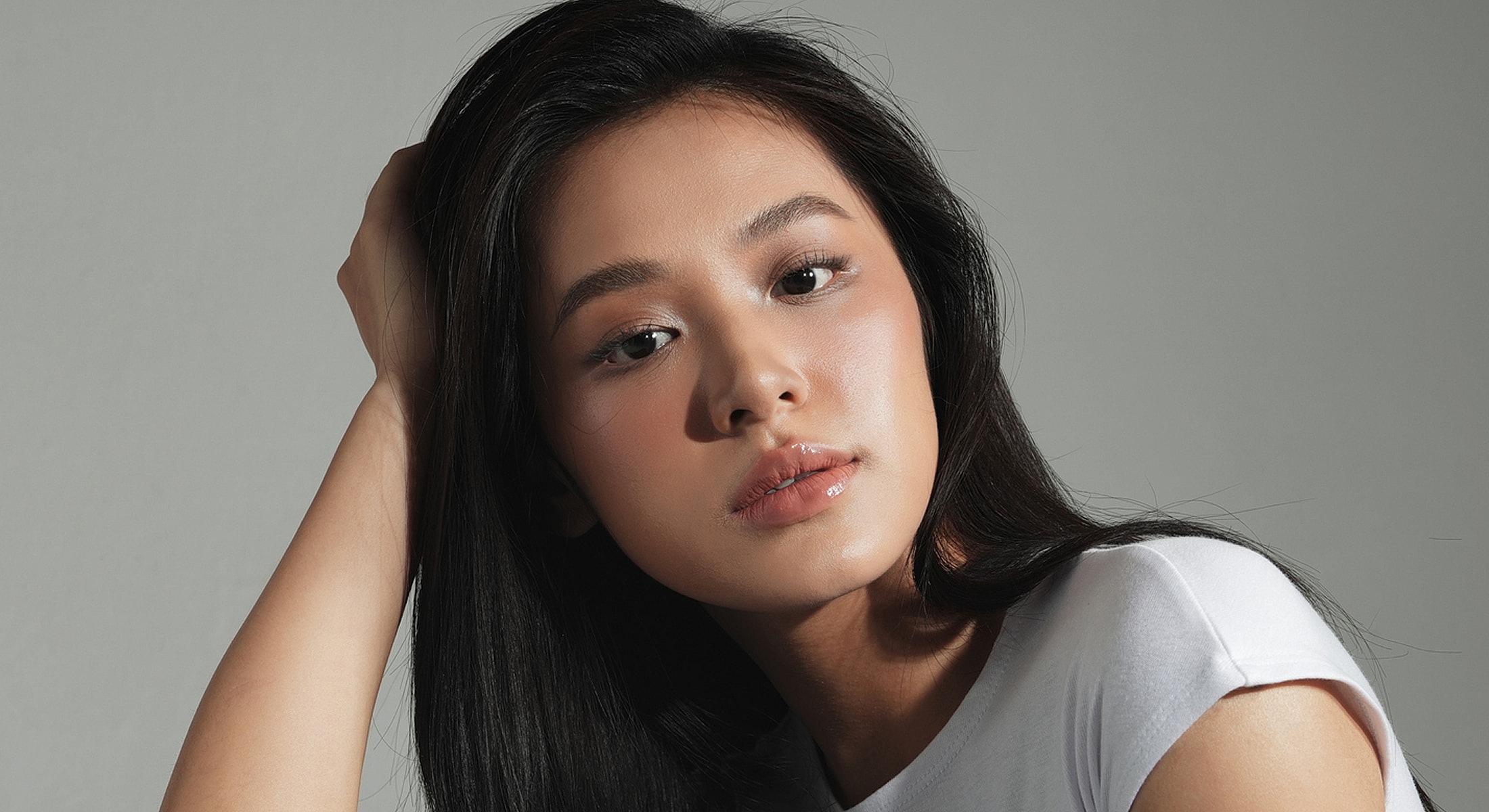 Portrait of a woman with long black hair.