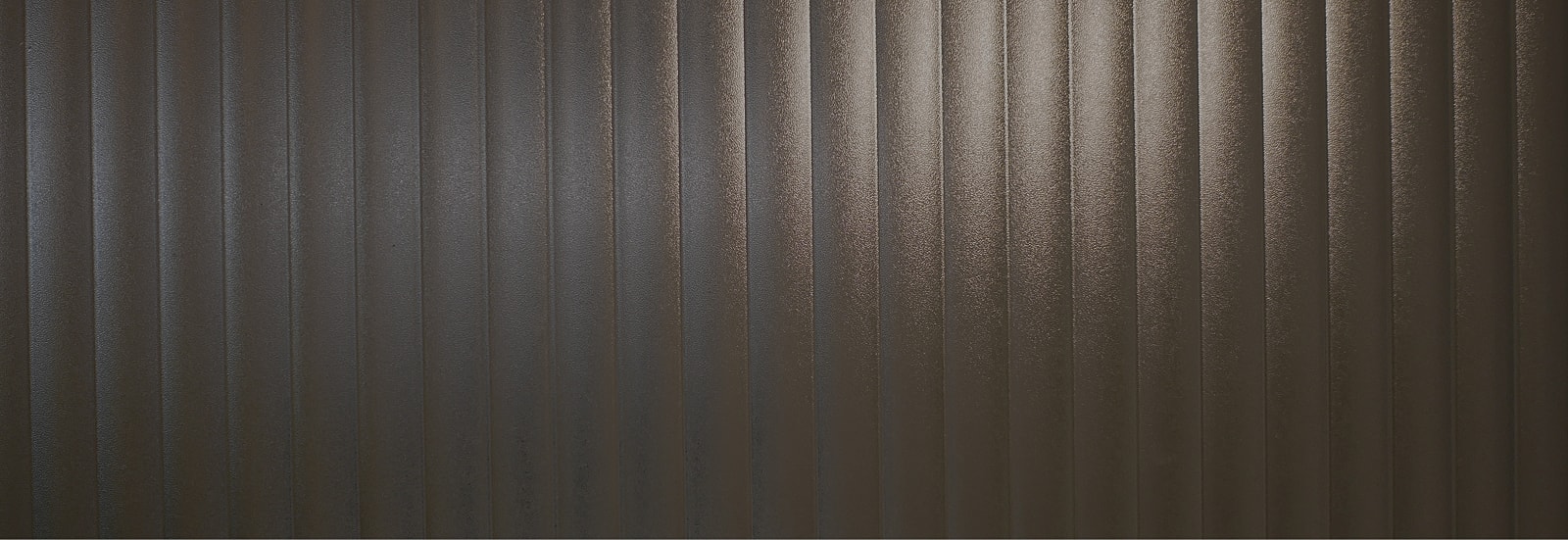 Textured dark vertical striped surface.